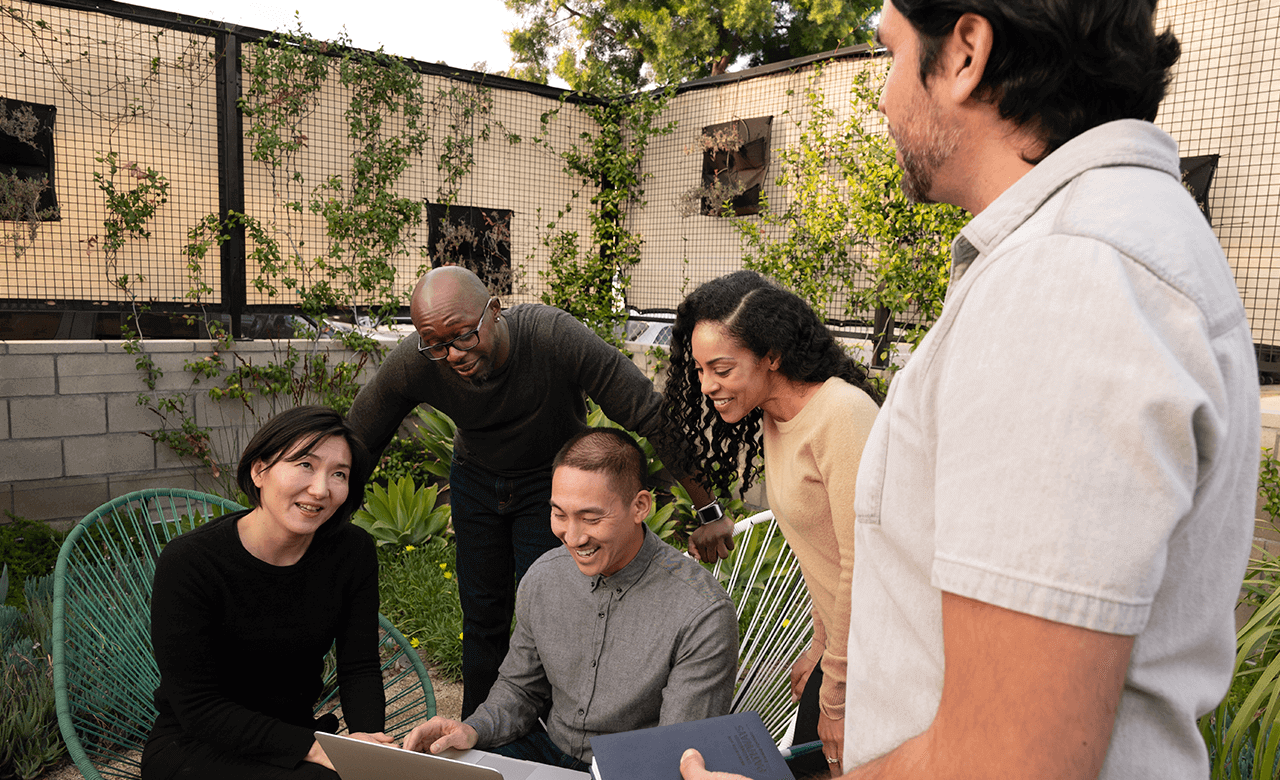 photo of a group of people discussing how to build a successful team
