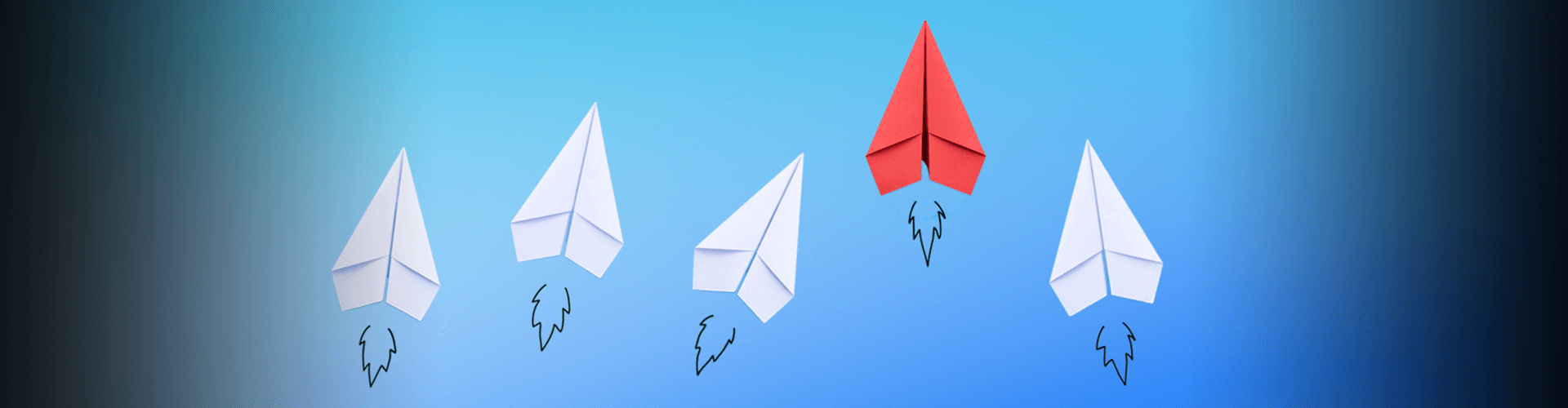 White and red paper airplanes in sky