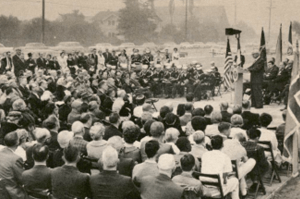 Man speaking to crowd of people