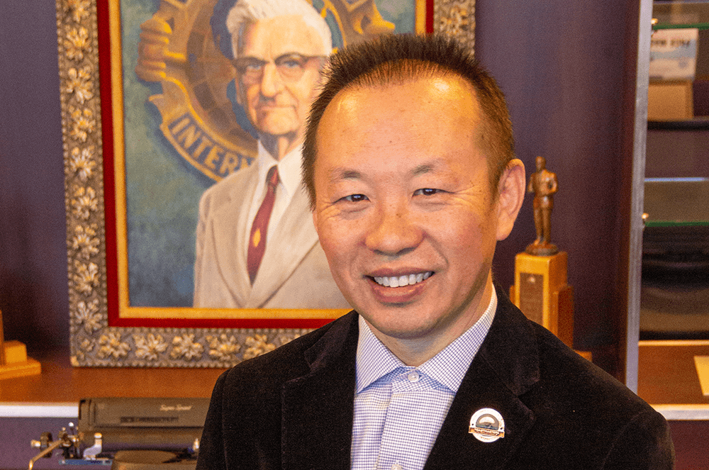 Man in black suit in Toastmasters museum