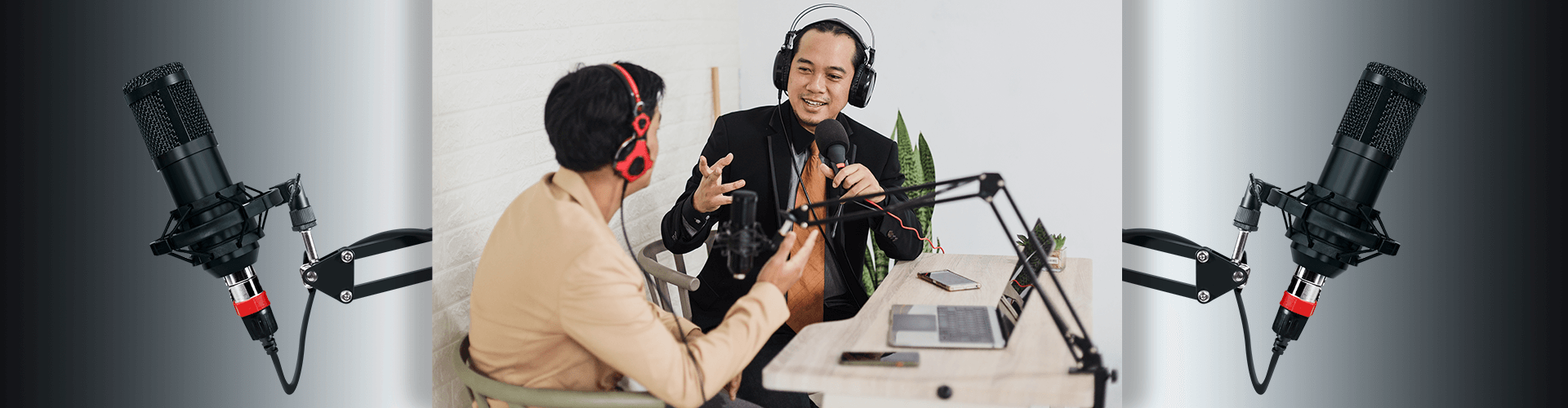 Two men wearing headphones speaking into microphones during podcast interview