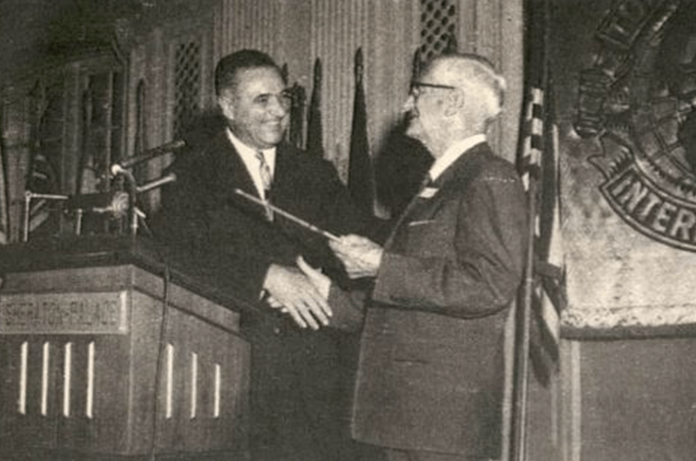an handing Dr. Ralph C. Smedley the key to the city