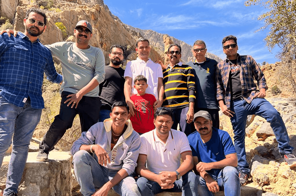 Group of people posing outdoors in Oman
