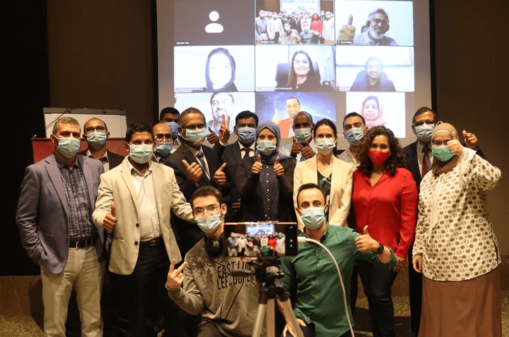 In September 2020, Qatar Toastmasters Club in Doha, Qatar, hosted its first hybrid meeting, abiding by government regulations. A few members attended in person and wore masks, while others participated virtually.