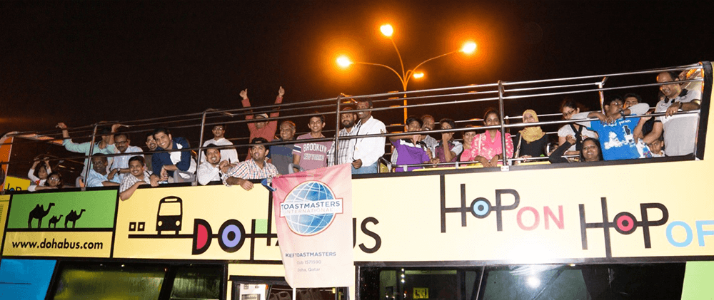 To mark the club’s third anniversary, KEF Toastmasters hopped atop a double-decker bus in Nvoember 2013. Their families and members of the KEF Gavel Club joined in on the celebration. Toastmaster of the Day Jyothikumar Chandran led the meeting as the bus toured local landmarks in Doha, Qatar.
