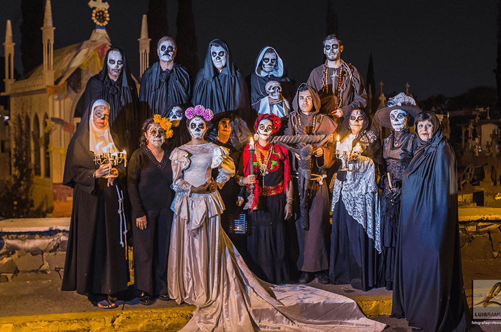 Members of the Tlaquepaque Club in Tlaquepaque, Mexico, celebrate Dia de los Muertos (Day of the Dead) dressed in full costume. The club was invited by local authorities to give speeches while walking around the town center in Tlaquepaque; they concluded with seven speeches at the cemetery.