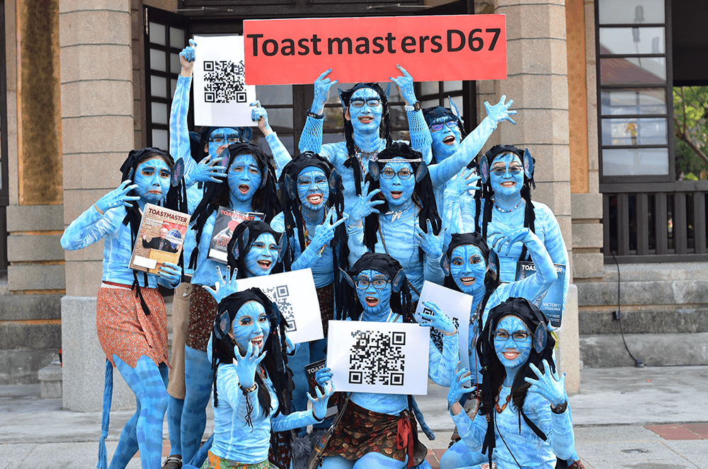 Members of Tainan Toastmasters club promoted District 67 at the Lunar New Year Festival in Tainan, Taiwan. The group, dressed as characters from the 2009 film Avatar, carried copies of the Toastmaster magazine, as well as the QR-code for their district’s Facebook page.