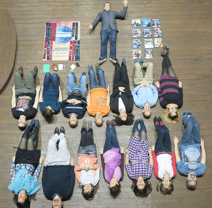 Members of PestBeszéd Toastmasters of Budapest, Hungary, create a “Tetris Challenge” photo. The grid format, a nod to the 1980s video puzzle Tetris, was adopted by emergency service professionals to visually organize the equipment they use on jobs. The Tetris Challenge is now a photo trend among global emergency units. This club created its own Tetris image, placing people and meeting props in logical order.