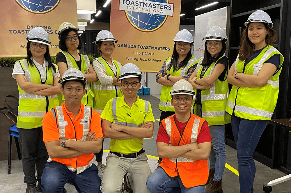 Members of Gamuda Toastmasters of Petaling Jaya, Selangor, Malaysia, dress up as site engineers and construction workers in honor of their meeting theme: “Uniformity in Diversity.” The joint meeting was held with clubs from District 102, Division D (Selangor, Pahang, and Terengganu). Many members of Gamuda Toastmasters—a corporate club—work in the construction and engineering fields Gamuda specializes in.