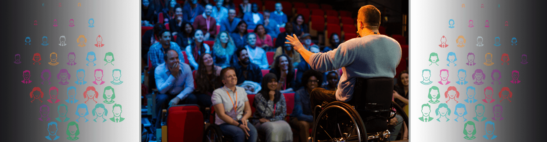 Man in wheelchair onstage speaking to audience