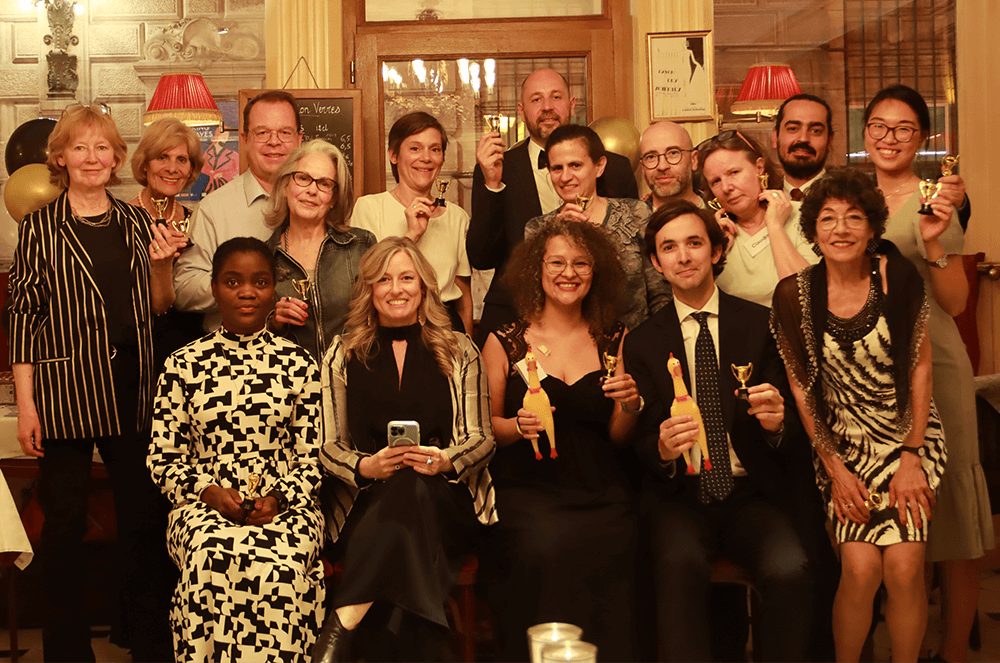 Group of people dressed in formal wear for Oscar-themed party