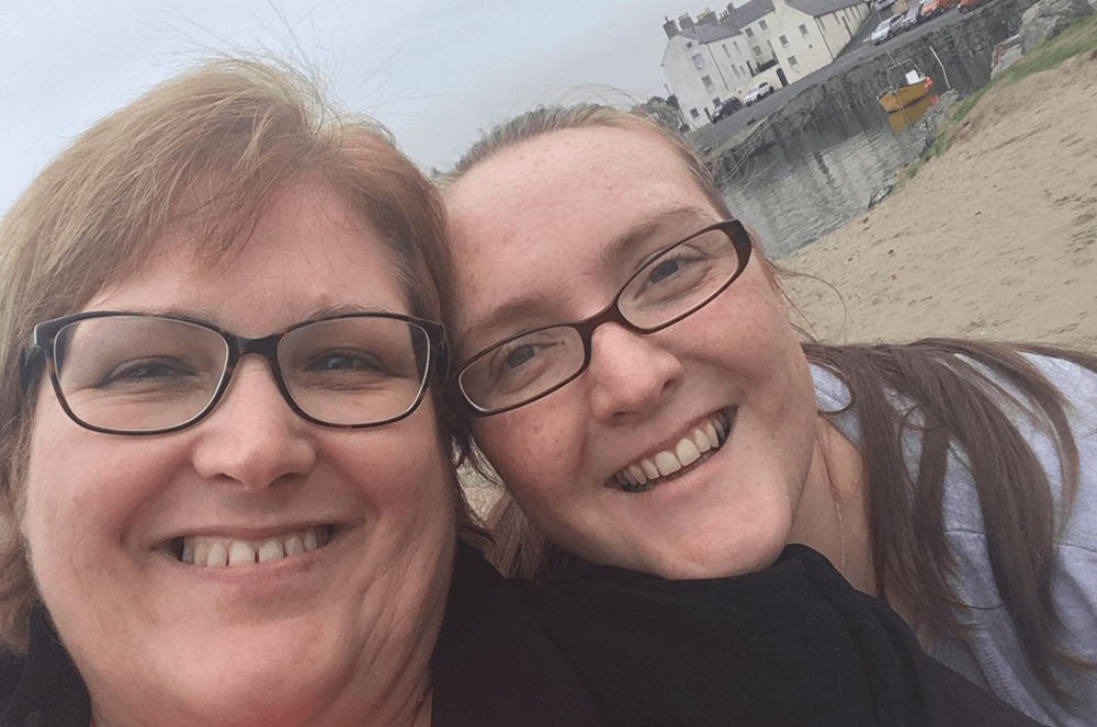 Morag and her niece, Hazel Anderson (also a Toastmaster) pose for selfie on the beach.