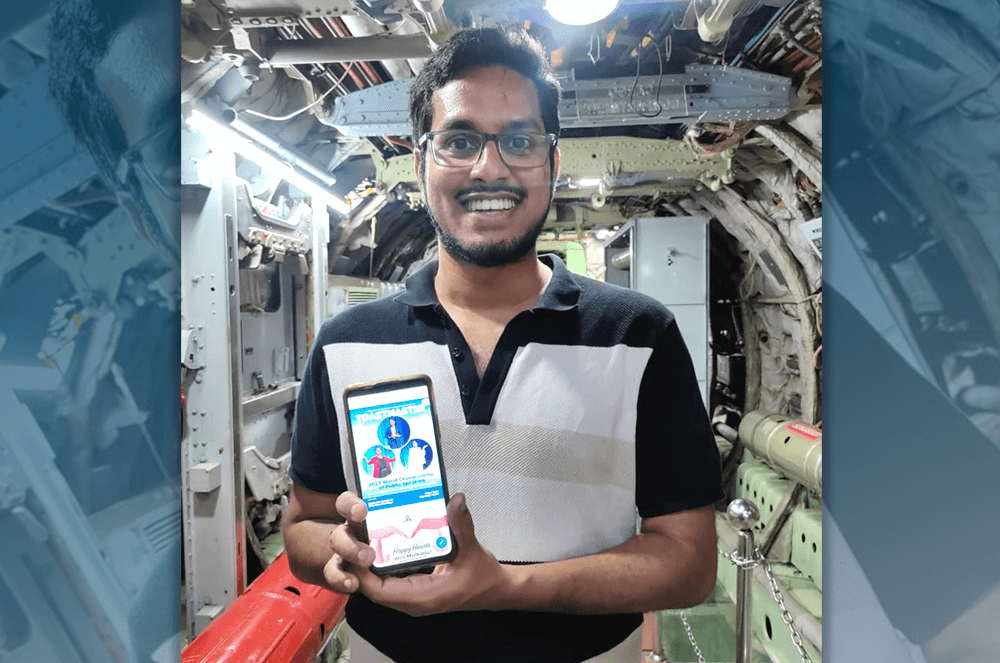 Man iPhone with Toastmaster magazine issue at aircraft museum in India