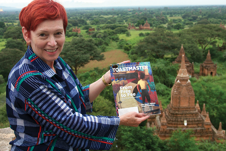 Nancy Norton, ACG, CL, from Paris, France, stands on top of a historic temple overlooking the southeastern plains of Bagan, Myanmar.