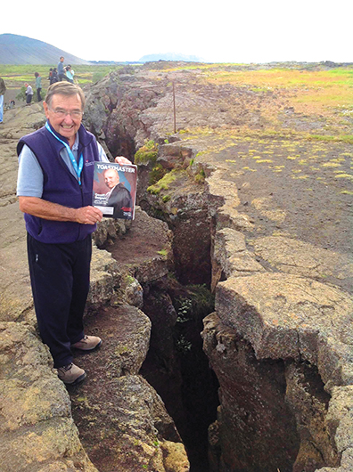 Dave Culton, ACG, CL, from Ventura, California, stands along a fault line between the North American and Eurasian tectonic plates in Thingvellir, Iceland.