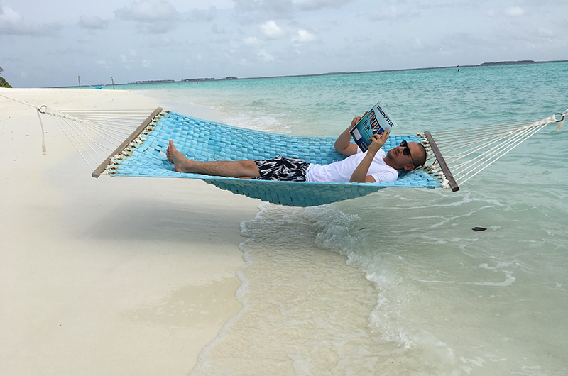 Maruf Yusupov, CC, CL, from Aarhus, Denmark, relaxes on Iru Fushi island in the Maldives.