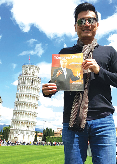 Glenn Lim, DTM, from Singapore, takes in the sights near the Tower of Pisa in Italy.