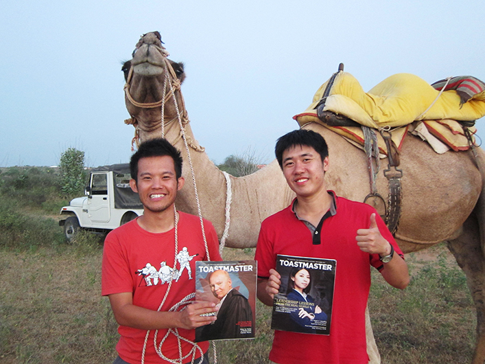 Beng Tack Cheah, CC (left) and Yen Shen Chan (right), from Malaysia, pose with their camel travel companion during their trip around the Osian Sand Dunes near Rajasthan, India.