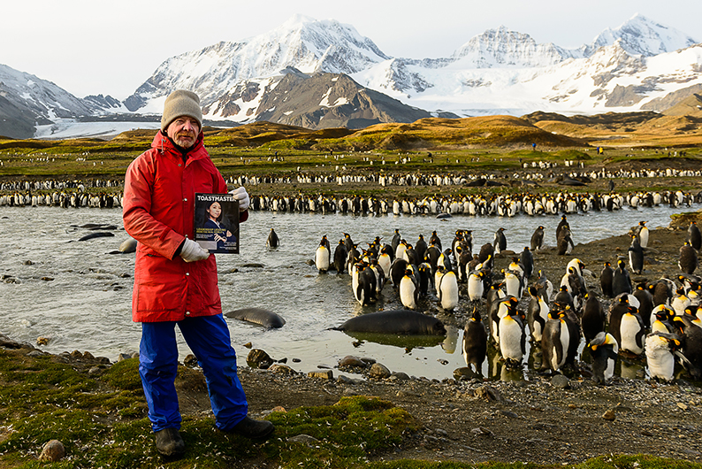 Keith Barnett, ACS, ALB, from Queensland, Australia, enjoys seeing penguins and seals at St. Andrews Bay in South Georgia, Antarctica. 