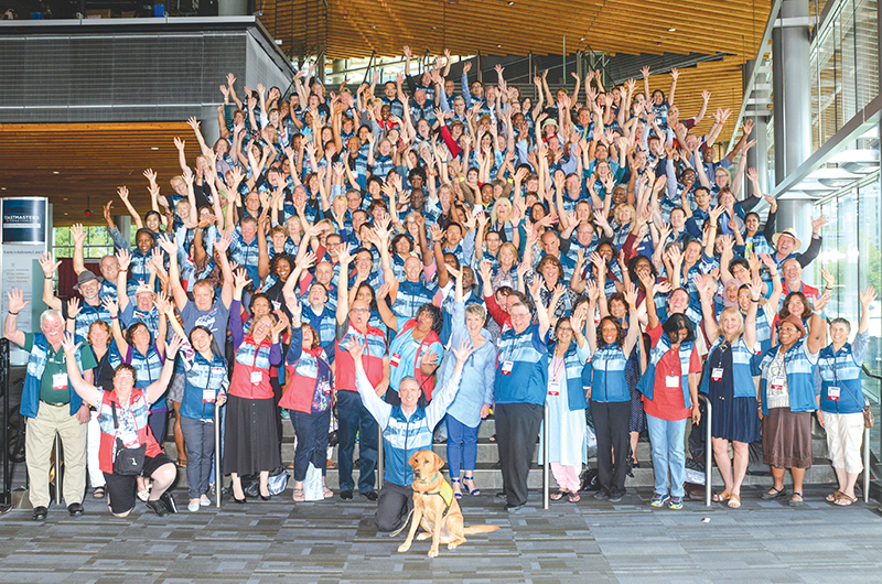 The many volunteers serving as Helping Hands pose for a moment.