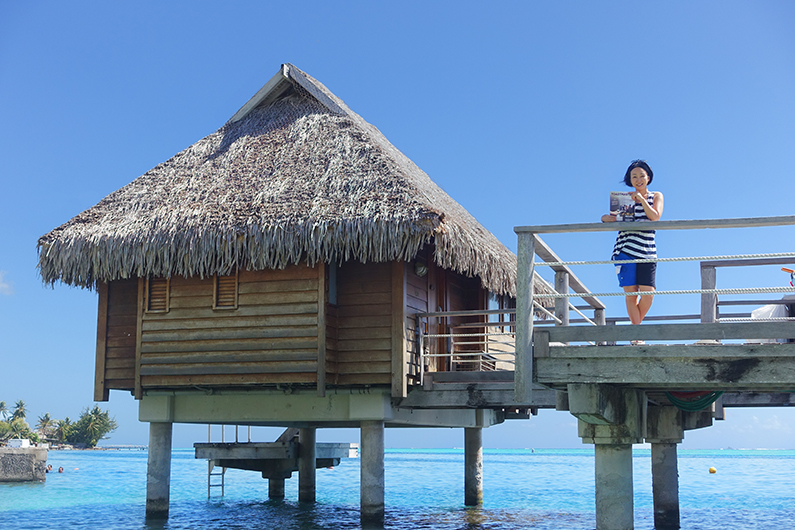 Masako Tsutsui, CC, from Tokyo, Japan, enjoys the view from an overwater bungalow on Moorea Island, Tahiti.