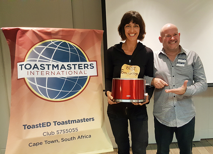 ToastED club members pose with a toaster reward for Best Evaluator.
