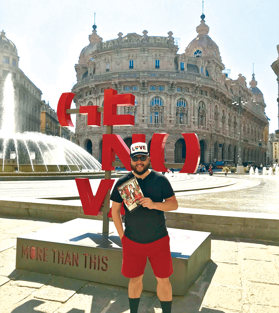 Aaron Kim, of Long Island, New York, U.S., enjoys the colorful art and ancient architecture in Genoa, Italy.