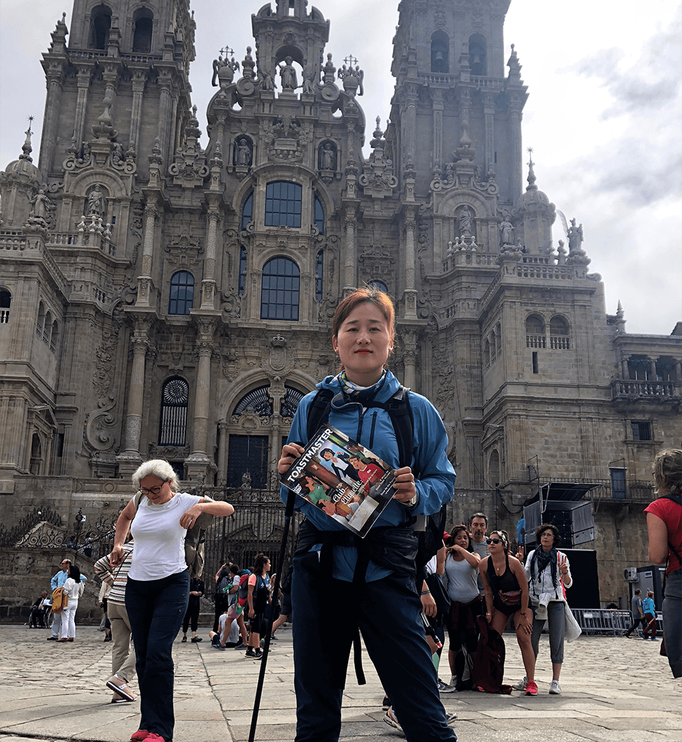 Huihui Chen, CC, from Shenzhen, Guangdong, China, stops in Santiago de Compostela, Galicia, Spain, after hiking the Camino de Santiago pilgrimage route for 16 days.