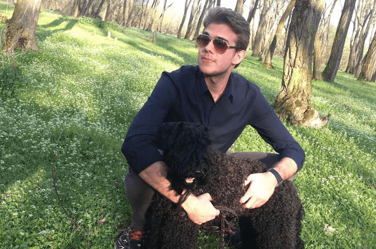 Toastmasters@AUBG Vice President Membership Stefan Solarski poses with his dog.