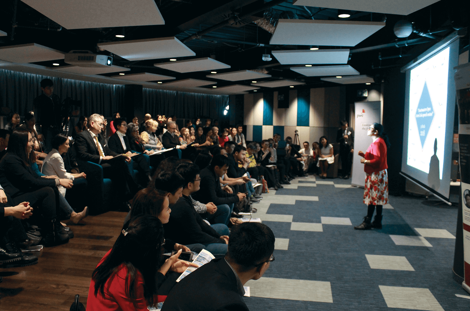 A contestant of the Open Central Asia speech contest is pictured onstage presenting her speech. Photo Credit: Gulnar Aden