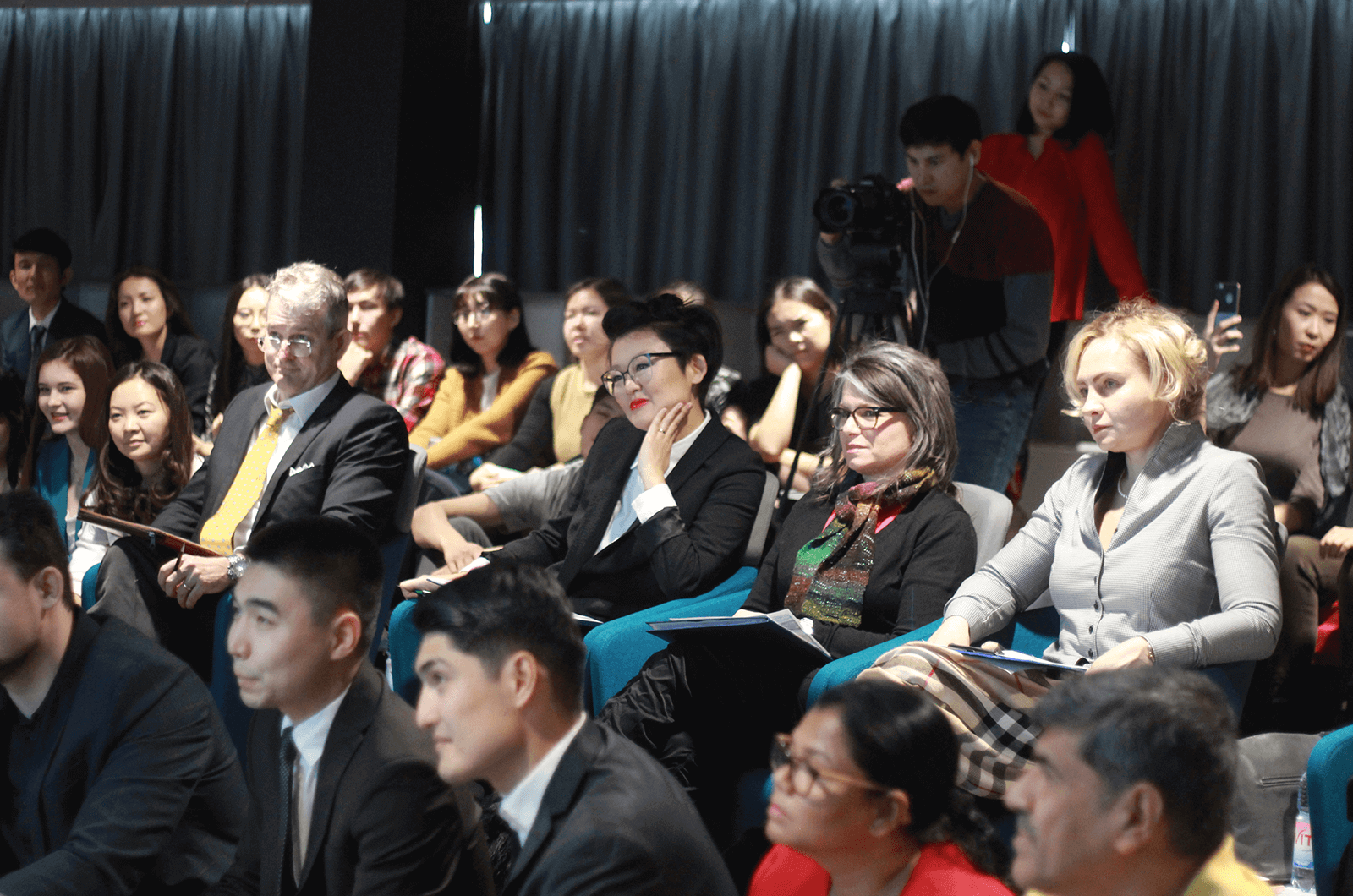 Judges of the Open Central Asia speech contest evaluate speakers. Photo Credit: Gulnar Aden