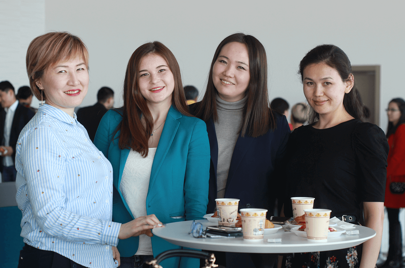 Attendees pose for a photo while socializing at the Open Central Asia speech contest. Photo Credit: Gulnar Aden