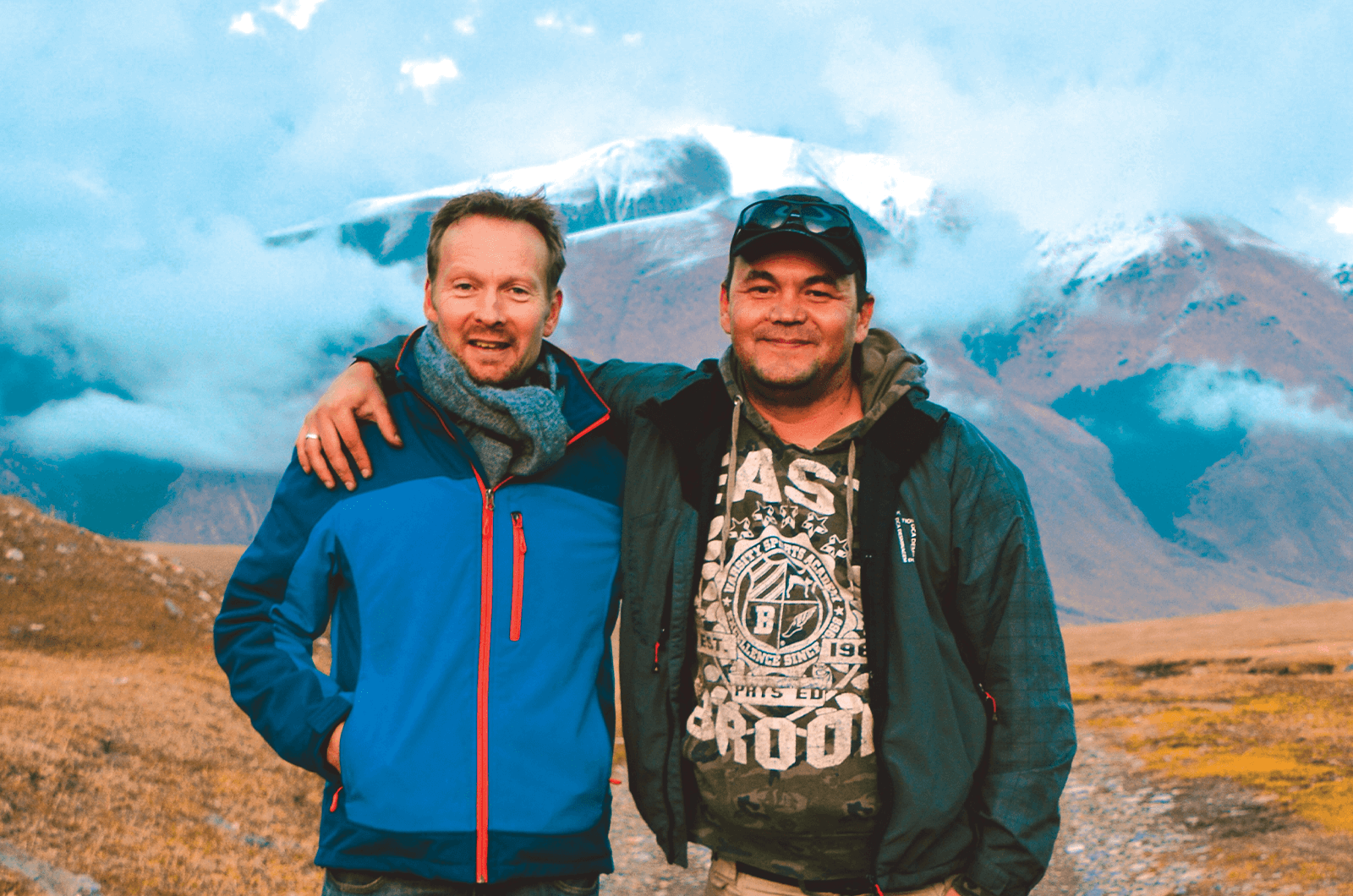 Veteran Toastmaster and tour guide, Barnaby Davies, left, and Marat Akunov, a driver and guide in the Kyrchyn Gorge, Kyrgyzstan. Photo by EastguidesWest
