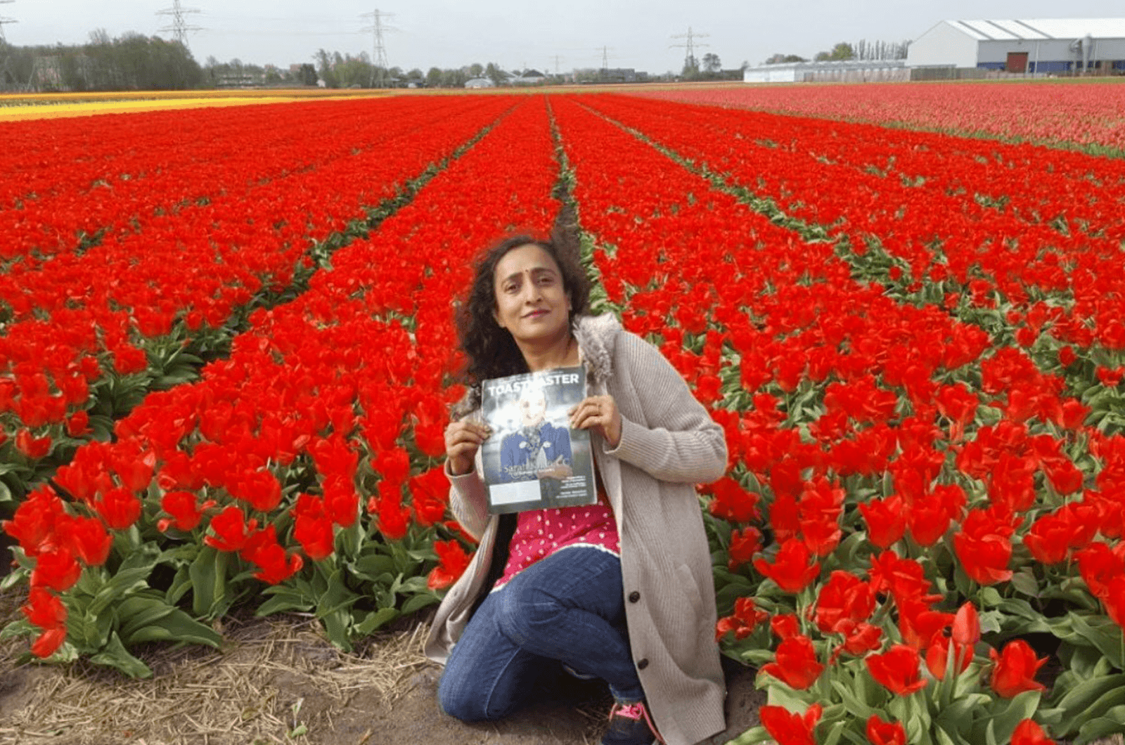 Gomathy Ram, CC, ALB, of Dubai, United Arab Emirates, relaxes in a tulip field in the Netherlands.