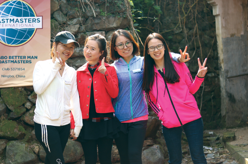 Members of Ningbo Better Man Toastmasters in Ningbo Zhejiang, China, express their enthusiasm for their club with warm smiles.