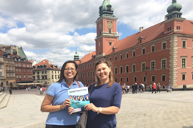 Shiellah Quintos, ACB, ALB, (left) and Ula Modzelewska, from Montreal, Canada, stand before the Royal Castle in Warsaw Old Town, Poland.