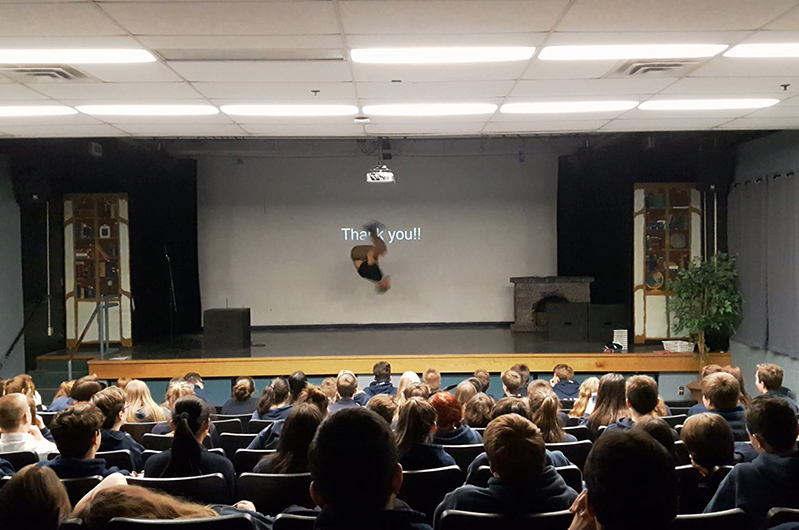 A former cheerleader and yoga instructor, Myles uses his talents to wow his audience of kids by performing a backflip onstage. 