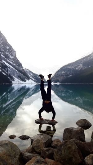 Myles takes a break from the stage to perform a handstand.