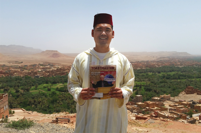 John D. Lin, DTM, from Little Neck, New York, poses in Fez, Morocco, dressed in traditional Deraa and Tarboosh.