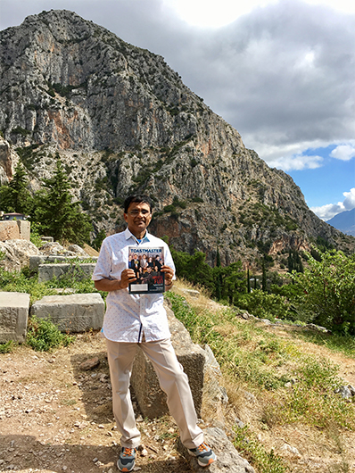 Divakaran Rajagobi, CC, CL, from Bahrain, stands in the hills of Delphi in Greece. 