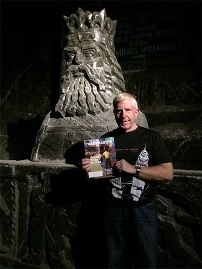 Richard Kummins, DTM, from Houston, Texas, poses next to a rock salt sculpture of King Kazimierz The Great, King of Poland from 1333 to 1370. It is in the Wieliczka Salt Mine, near Krakow, Poland. 