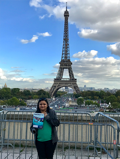 Sharon Kruvilla, from Dubai, United Arab Emirates, poses near the Eiffel Tower in Paris. 