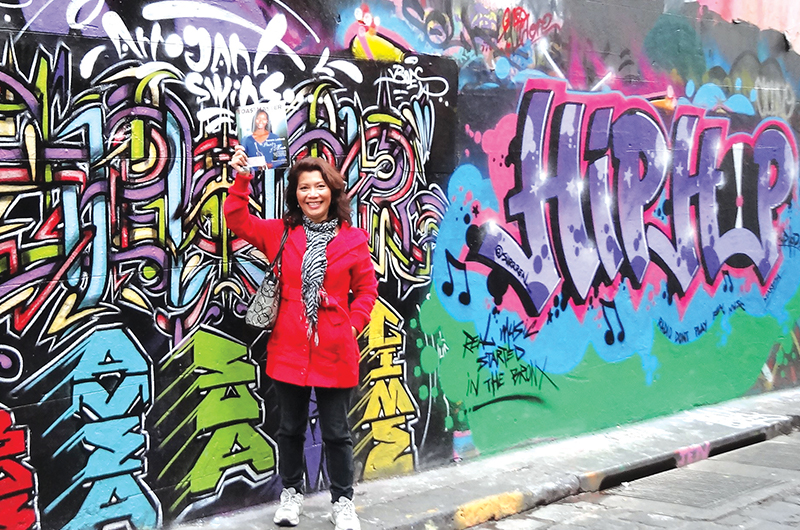 Teresa Brake, ACG, ALB, from Broadbeach Waters, Queensland, Australia, poses in front of famous artwork in Melbourne, Australia.