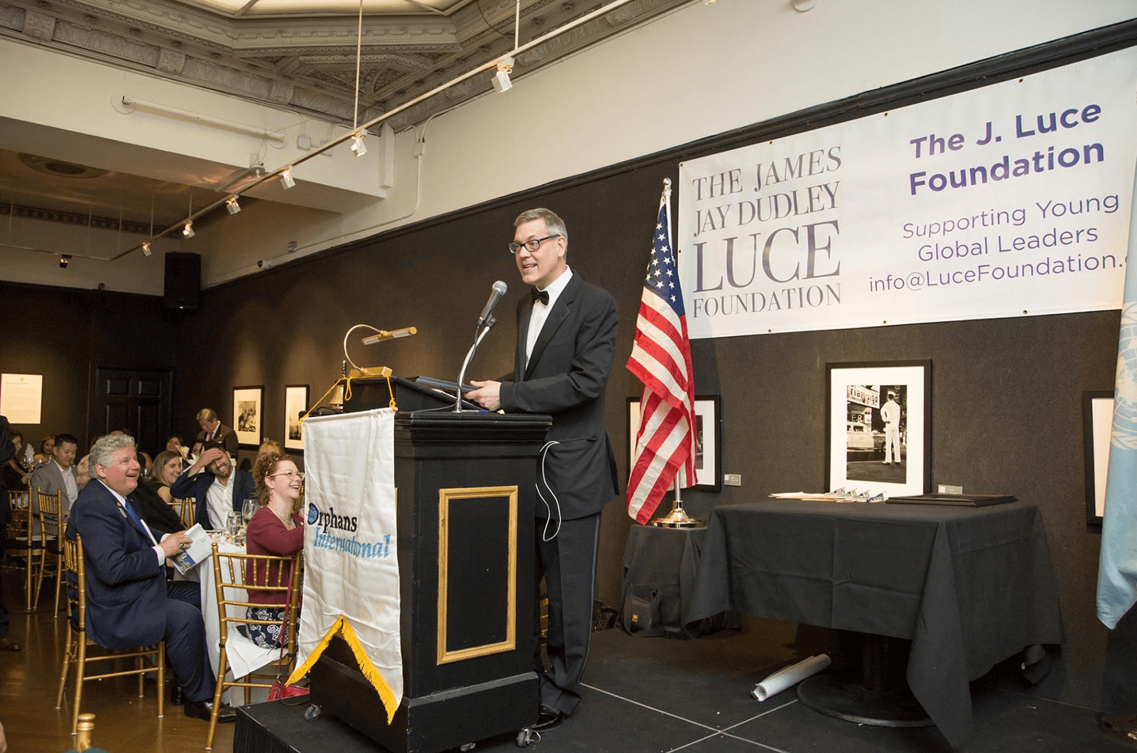 Jim Luce speaks to a crowd on behalf of the Jim Luce Foundation, supporting the Young Global Leaders program.