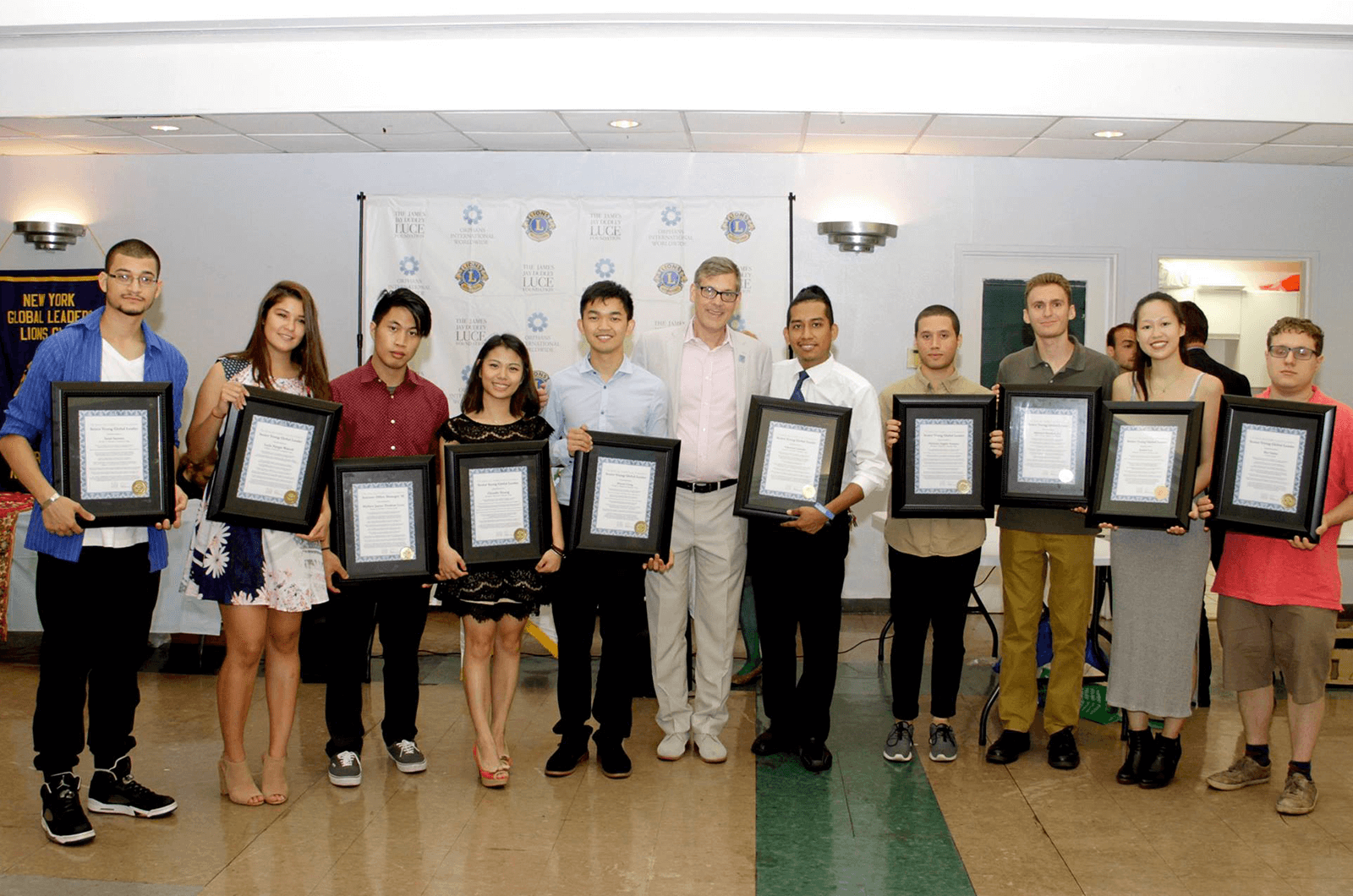 Luce (center) poses with a group of Young Global Leaders. Photo by Mangala Weerasekera