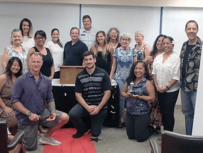 Kauai Toastmasters club gather on red carpet for awards-themed meeting 