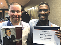 Garth Thomson and Matimu Marcus Manganyi hold Distinguished Club certificate