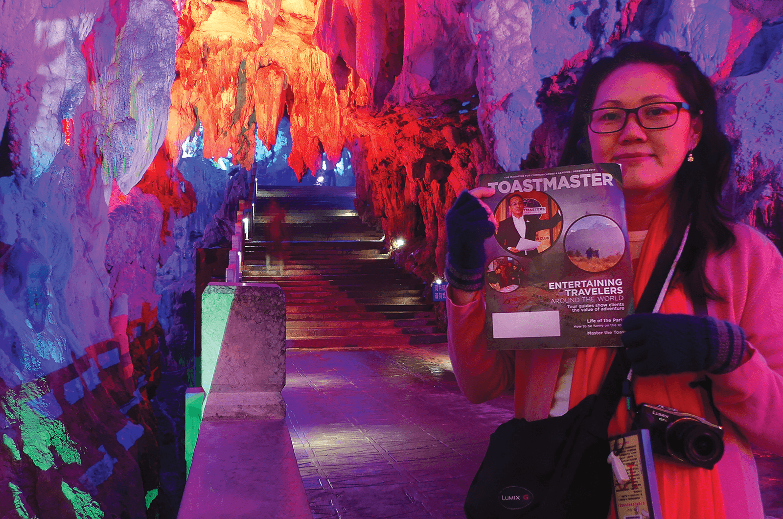 Eve Wong of Selangor, Malaysia, walks through dramatically-lit stalactites in the Silver Cave—a multilevel cave meandering through 12 mountain peaks—in Guilin City, Guangxi Province, China.