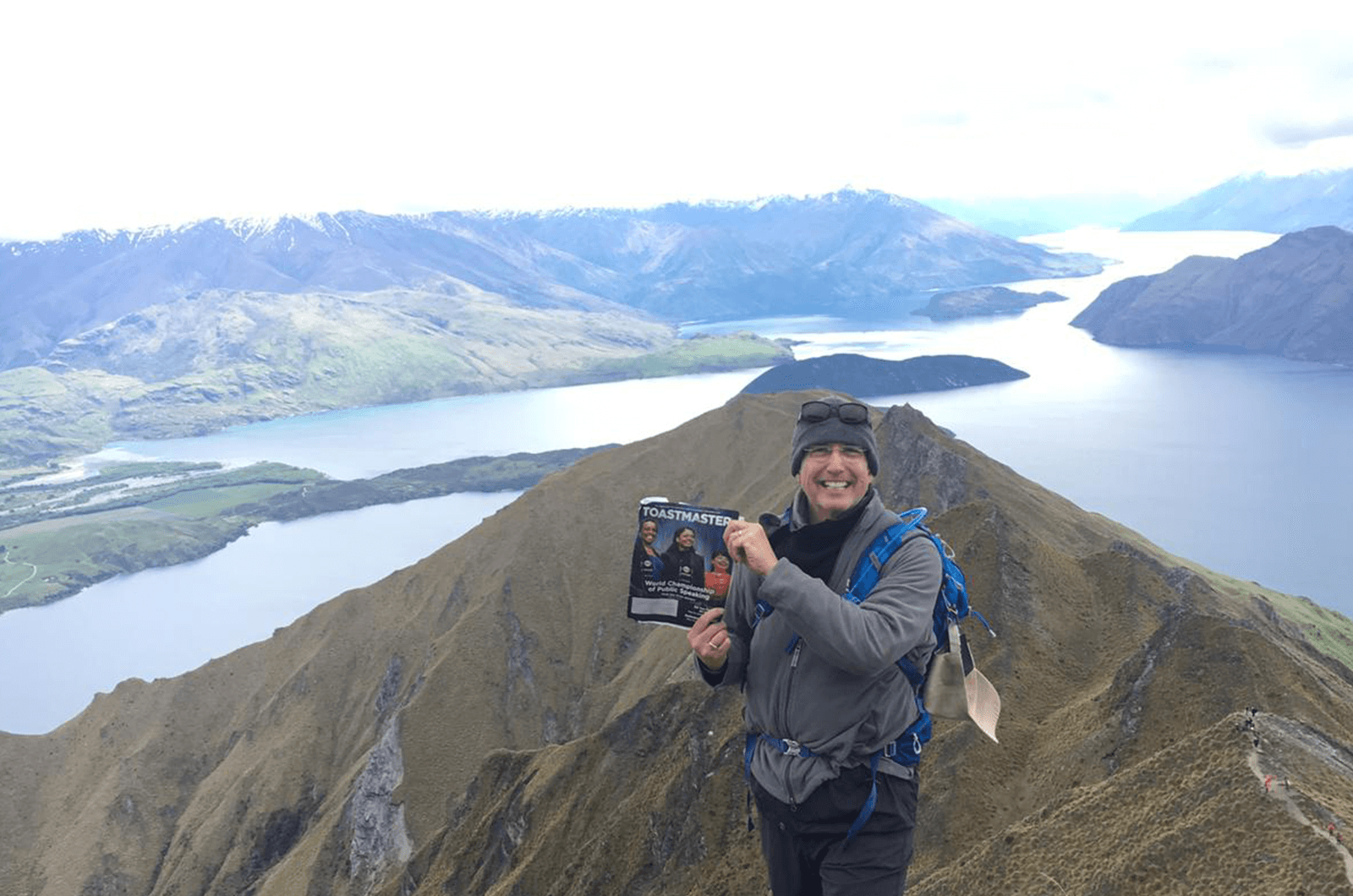 John Locke, DTM, of Asheville, North Carolina, stands near the 5,100-foot summit of Mount Roy, overlooking Lake Wanaka, New Zealand.