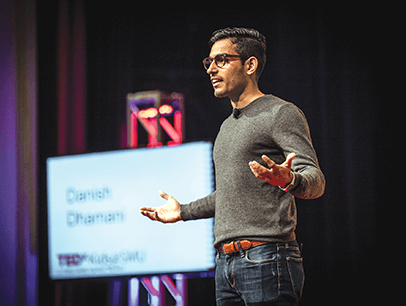 Danish Dhamani speaks onstage at TEDx